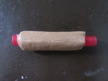 Leukotape wrapped around a small section of straw, a necessity in my first-aid kit!